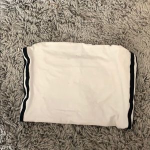 white tob top with 2black strips on each side